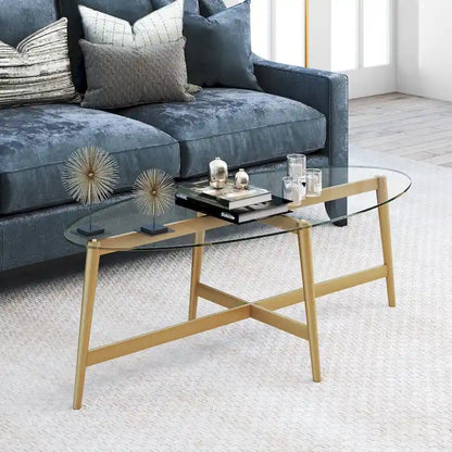Table basse ovale en verre trempé – Laiton / Bronze noirci, pieds effilés en acier
